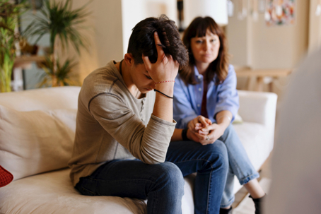 mother comforting teen son