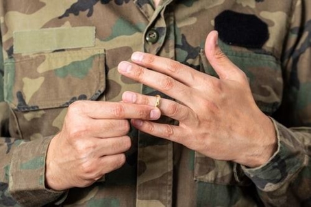 military member with a wedding ring