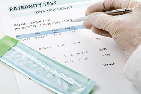 person filling out paternity test