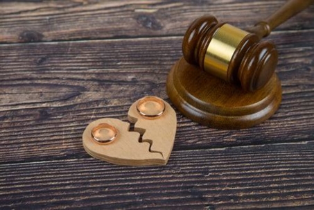 gavel and broken heart on table