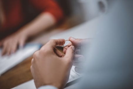 couple holding wedding ring